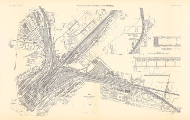 Ein detaillierter alter Stadtplan, der zahlreiche Straßen, Gebäude und Text enthält, einschließlich Straßennamen, Parks und Sehenswürdigkeiten.